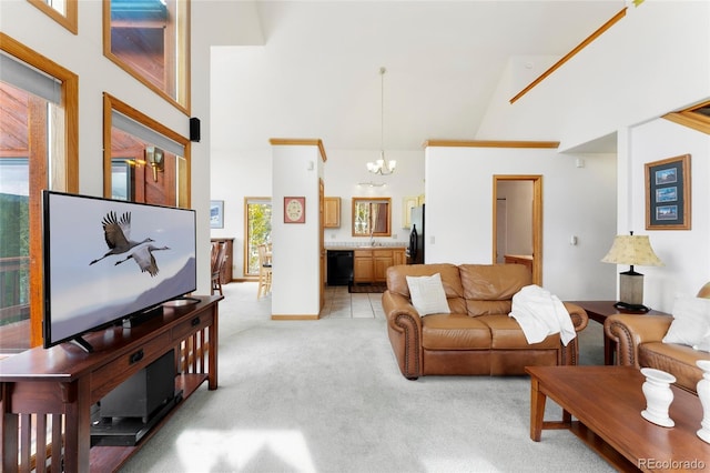 living room with light carpet, high vaulted ceiling, and a notable chandelier