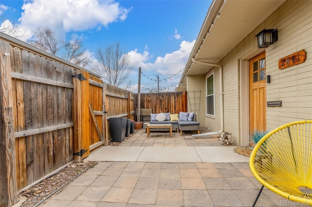 view of patio with fence and an outdoor living space