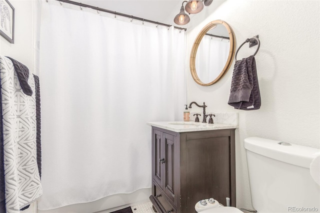 bathroom with toilet, shower / tub combo, and vanity