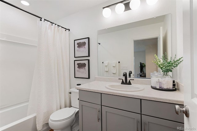 bathroom featuring toilet, shower / bathtub combination with curtain, and vanity