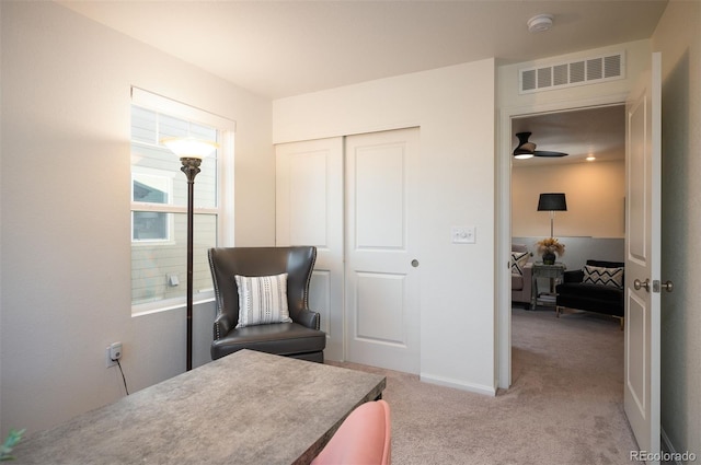 bedroom with light colored carpet, a closet, visible vents, and baseboards