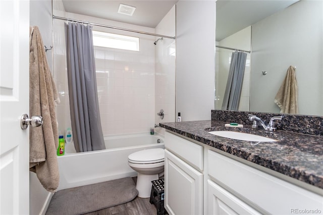 5672 Tramore Ct, Colorado Springs, CO 80927 - bathroom featuring vanity, shower / bath combo, toilet, and wood finished floors