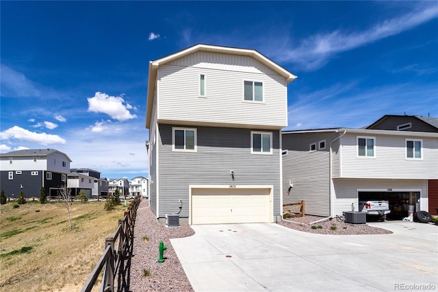 5672 Tramore Ct, Colorado Springs, CO 80927 - back of house with driveway, a garage, and cooling unit