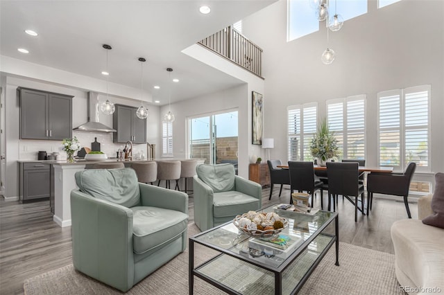 living room featuring light wood-type flooring and recessed lighting