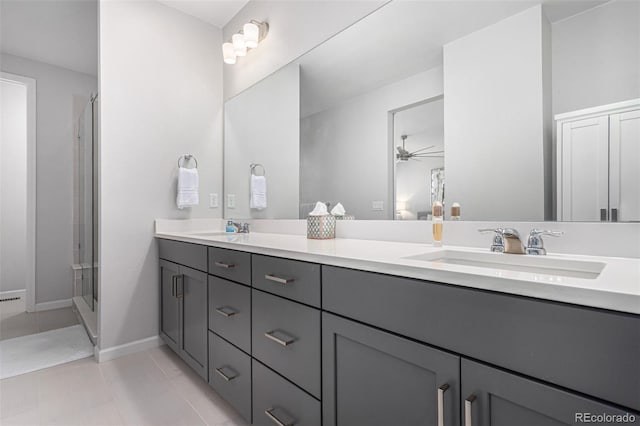 full bathroom with a sink, double vanity, an enclosed shower, and ceiling fan