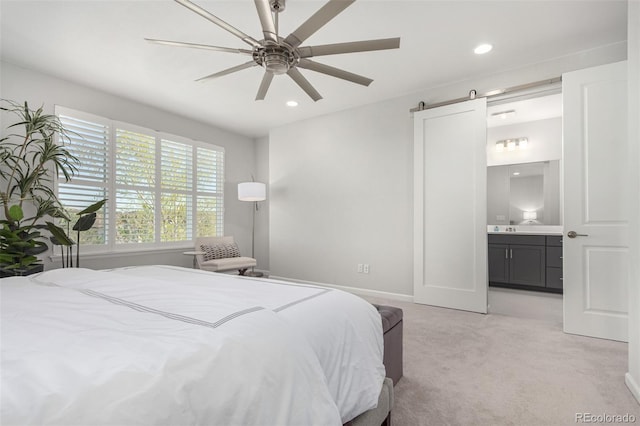 10524 Eby Cir, Lone Tree, CO 80124 - bedroom with light carpet, connected bathroom, recessed lighting, a barn door, and a ceiling fan