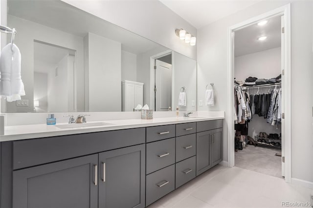 10524 Eby Cir, Lone Tree, CO 80124 - full bath featuring double vanity, a walk in closet, and tile patterned flooring