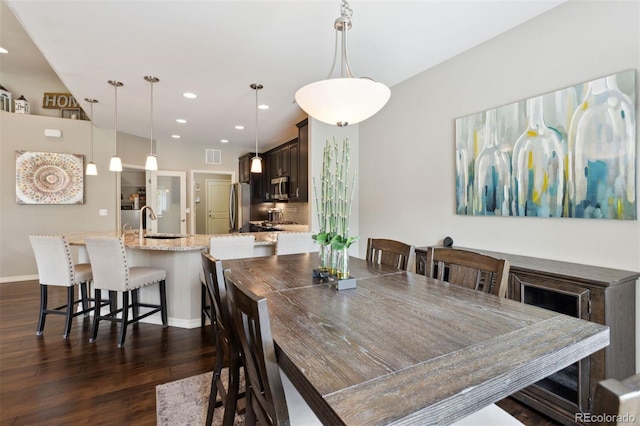 335 Mountain Brush, Colorado Springs, CO 80921 - dining area featuring dark wood finished floors, recessed lighting, and baseboards