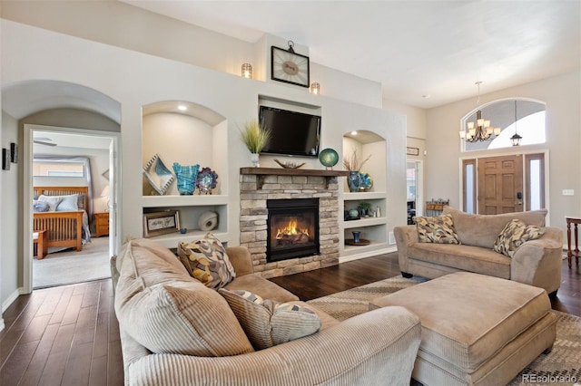 335 Mountain Brush, Colorado Springs, CO 80921 - living area featuring dark wood-type flooring, healthy amount of natural light, and a chandelier