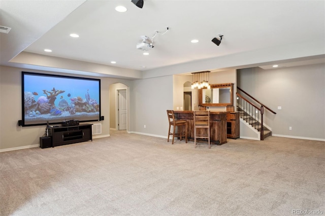 335 Mountain Brush, Colorado Springs, CO 80921 - carpeted cinema room with arched walkways, recessed lighting, bar, and baseboards