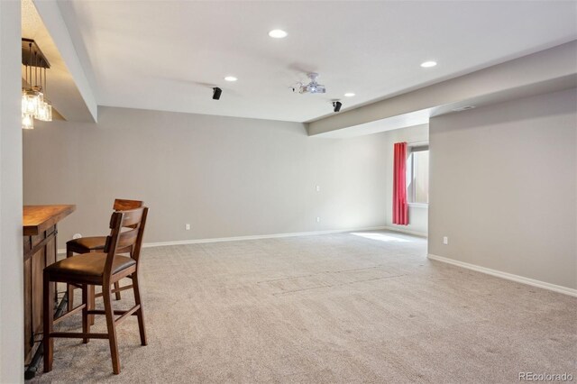 335 Mountain Brush, Colorado Springs, CO 80921 - living room featuring recessed lighting, light colored carpet, and baseboards