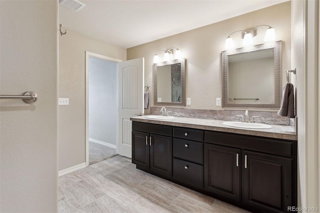 335 Mountain Brush, Colorado Springs, CO 80921 - full bathroom with double vanity and baseboards