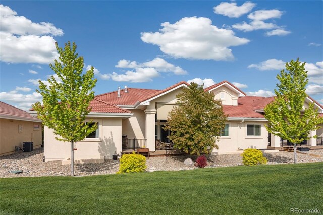 335 Mountain Brush, Colorado Springs, CO 80921 - view of front facade featuring a tiled roof, stucco siding, and a front yard
