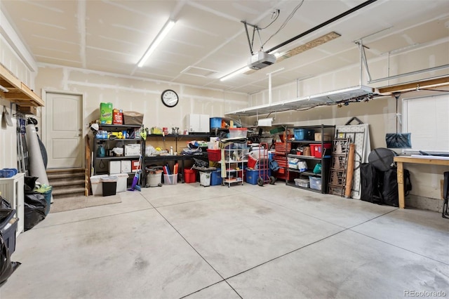 335 Mountain Brush, Colorado Springs, CO 80921 - garage featuring a garage door opener and a workshop area