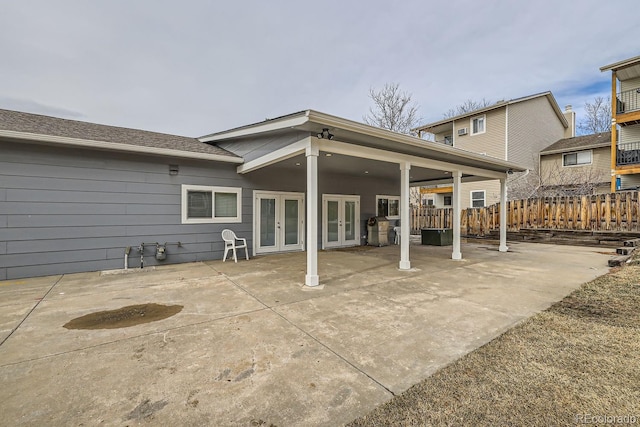 rear view of property with a patio and french doors