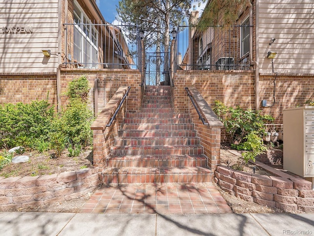 1011 N Pennsylvania St Unit H, Denver, CO 80203 - view of side of home featuring stairway and brick siding