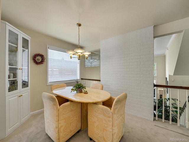 1011 N Pennsylvania St Unit H, Denver, CO 80203 - dining space featuring light carpet, a chandelier, and baseboards