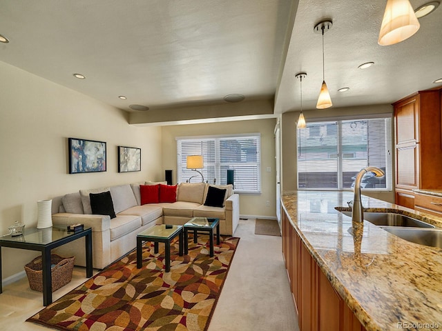 1011 N Pennsylvania St Unit H, Denver, CO 80203 - living room featuring light colored carpet, baseboards, and recessed lighting