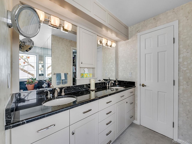 1011 N Pennsylvania St Unit H, Denver, CO 80203 - bathroom with wallpapered walls and double vanity