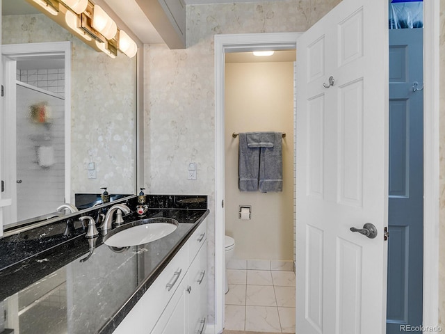 1011 N Pennsylvania St Unit H, Denver, CO 80203 - full bath with toilet, vanity, and marble look tile flooring