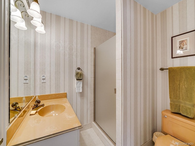 1011 N Pennsylvania St Unit H, Denver, CO 80203 - full bathroom featuring wallpapered walls, a chandelier, a shower stall, vanity, and toilet