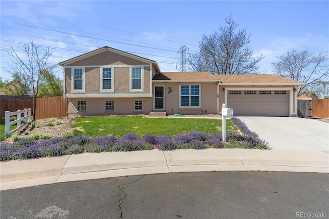 1853 S Zeno Way, Aurora, CO 80017 - split level home with a garage, concrete driveway, stucco siding, and entry steps