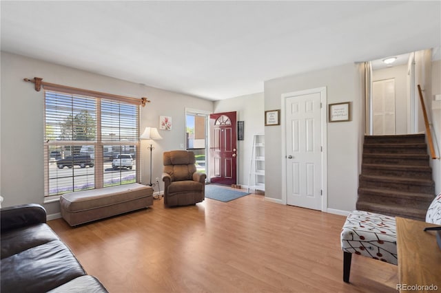 1853 S Zeno Way, Aurora, CO 80017 - living area with wood finished floors, stairway, and baseboards