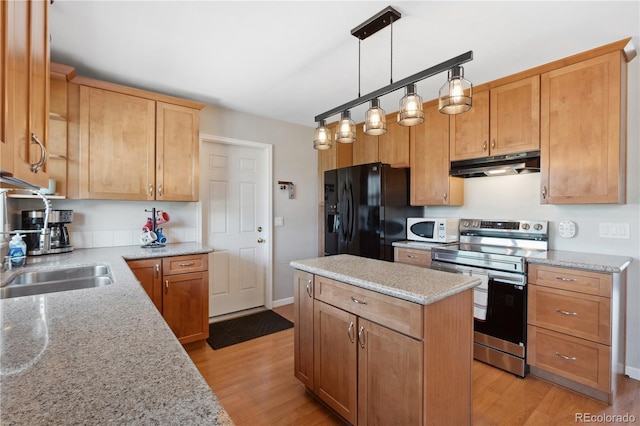 1853 S Zeno Way, Aurora, CO 80017 - kitchen featuring stainless steel electric range, under cabinet range hood, white microwave, black refrigerator with ice dispenser, and light wood finished floors