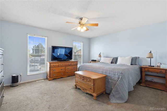 1853 S Zeno Way, Aurora, CO 80017 - bedroom with carpet floors, a ceiling fan, a textured ceiling, and baseboards