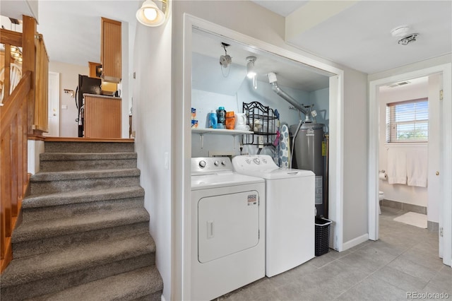 1853 S Zeno Way, Aurora, CO 80017 - laundry room with separate washer and dryer, water heater, light tile patterned flooring, and baseboards