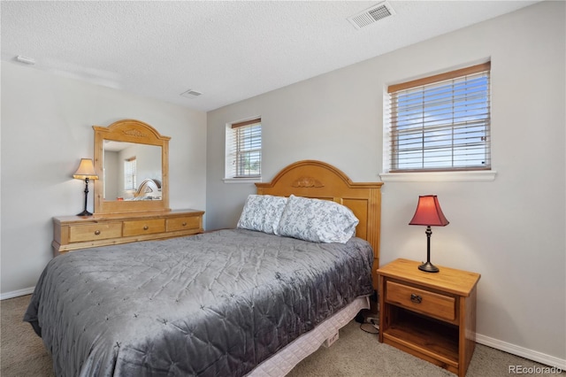 1853 S Zeno Way, Aurora, CO 80017 - bedroom featuring carpet floors, a textured ceiling, and baseboards