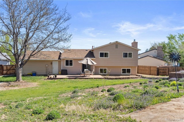 1853 S Zeno Way, Aurora, CO 80017 - back of house featuring a patio area