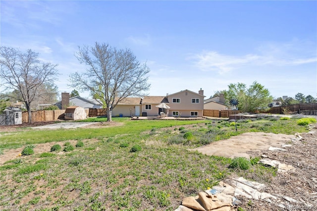1853 S Zeno Way, Aurora, CO 80017 - view of yard with a shed, an outbuilding, and a wooden deck