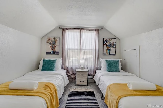 bedroom featuring lofted ceiling