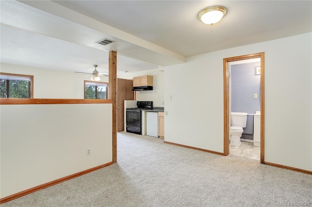 interior space with a ceiling fan, baseboards, visible vents, and light carpet