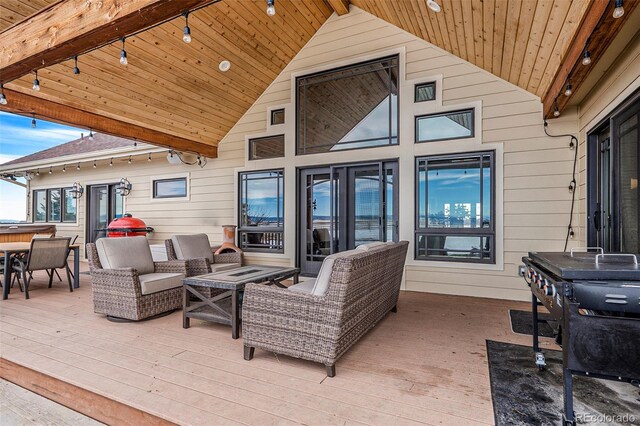 exterior space with an outdoor hangout area and a deck