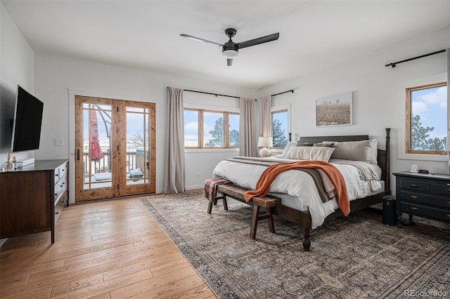 bedroom with ceiling fan, wood-type flooring, and access to outside