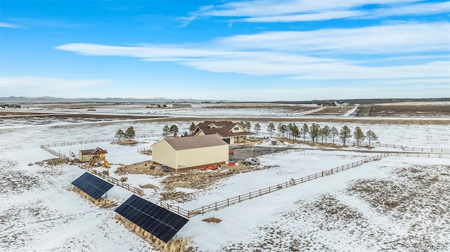 snowy aerial view featuring a rural view