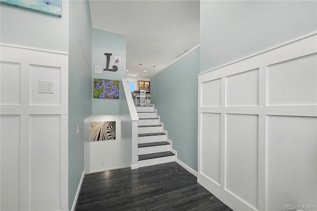 stairway featuring wood-type flooring