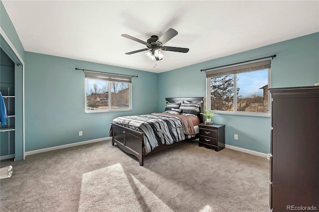 bedroom with ceiling fan and light carpet