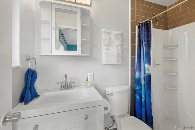 bathroom featuring vanity, toilet, and walk in shower