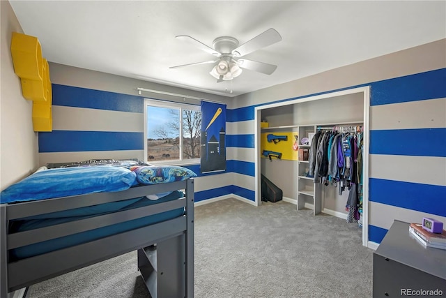 bedroom with carpet flooring, a closet, and ceiling fan