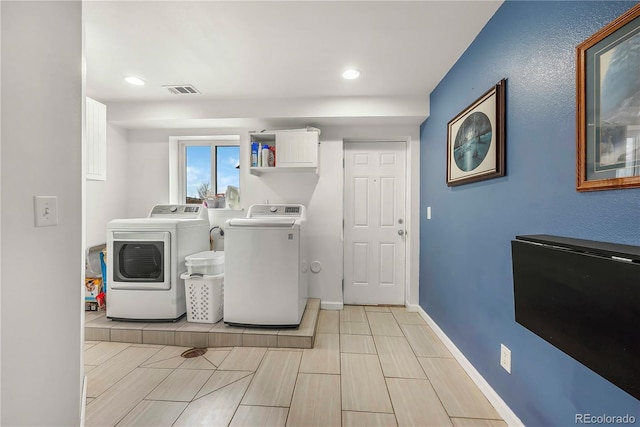 laundry room featuring separate washer and dryer