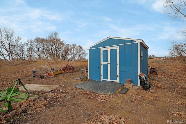 view of outdoor structure with a rural view