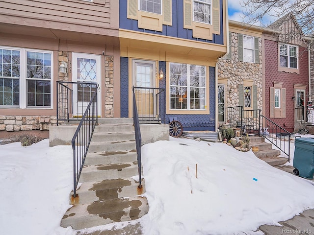 view of snow covered property entrance