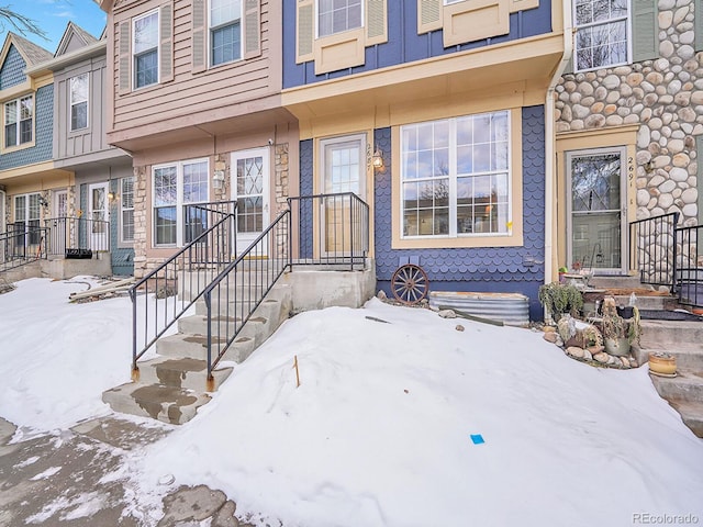 view of snow covered property entrance