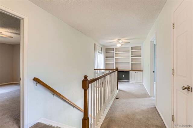4081 Odessa St, Denver, CO 80249 - corridor with a textured ceiling, an upstairs landing, light carpet, and baseboards