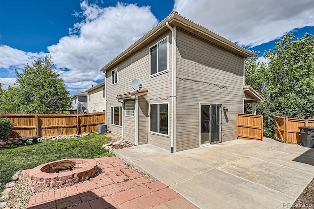 4081 Odessa St, Denver, CO 80249 - back of property with a fire pit, central air condition unit, and a patio area