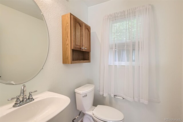 4081 Odessa St, Denver, CO 80249 - half bathroom with a sink and toilet