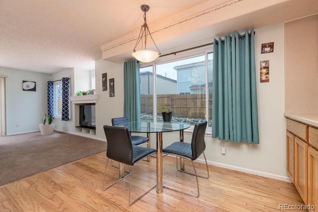 4081 Odessa St, Denver, CO 80249 - dining space featuring light wood-style floors and baseboards